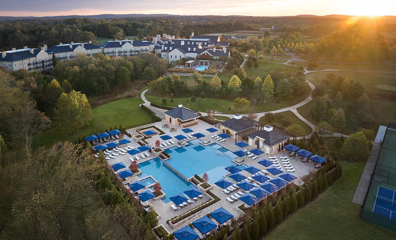 Aerial view of resort pool at sunset